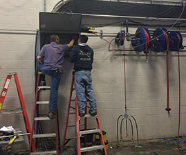 Employees Working on Panel